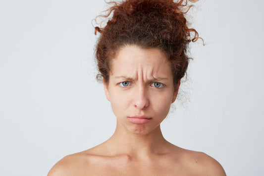 A woman with stress and an upset look on her face